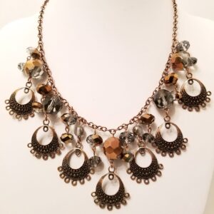 Copper plated metals with fired glass beads